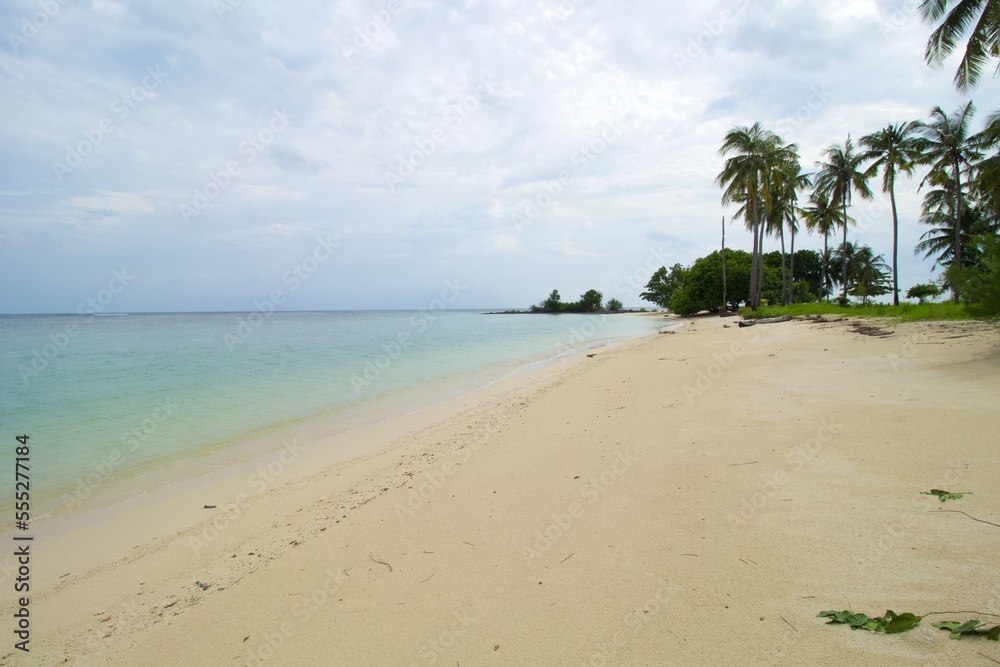 Tropical Beach, Wave and Blue Sea Water. This photo was taken on one of the tropical islands in Kotabaru, Indonesia.