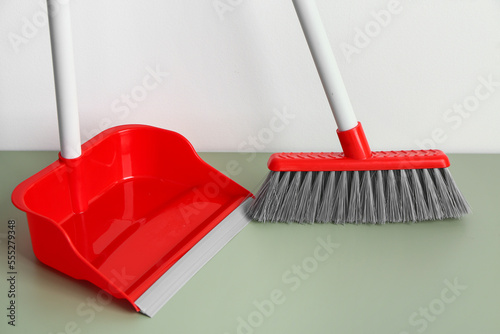 Red plastic dustpan and bro...