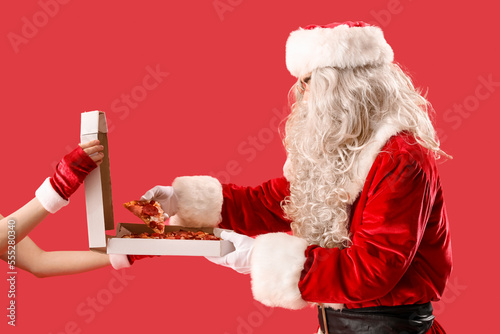 Santa Claus and hands holdi...
