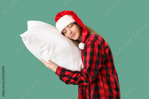 Sleepy young woman in Santa...