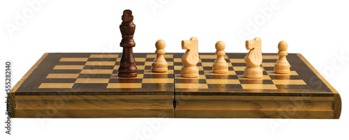 Wooden chess figures on a classic chessboard photo