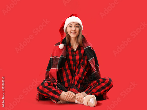 Young woman in pajamas with...