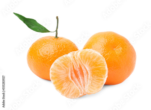 Fresh ripe juicy tangerines with green leaf on white background
