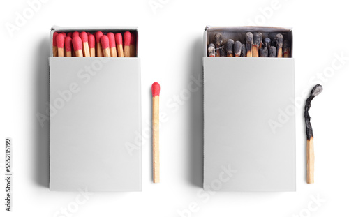 Top view of opened match boxes with burned matchsticks. Isolated on white background
