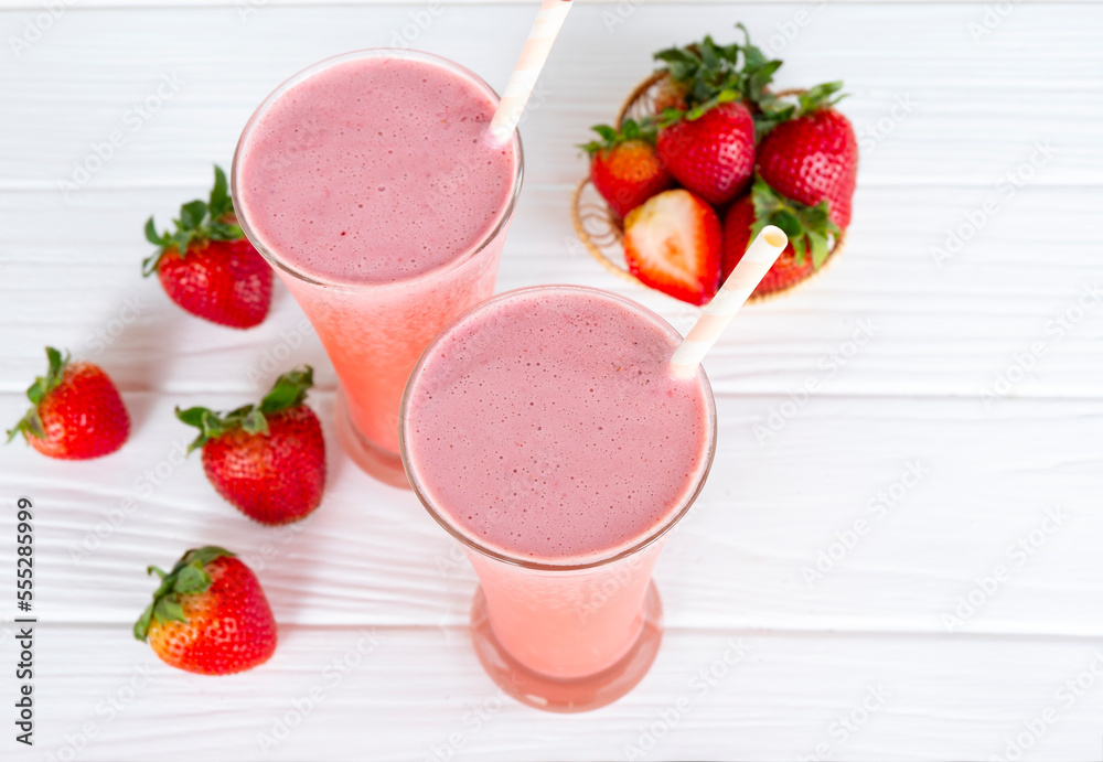 Strawberry yogurt fruit juice smoothie pink colorful fruit juice milkshake blend beverage healthy high protein the taste yummy In glass drink episode morning on white wood background. Strawberry yogurt fruit juice smoothie pink colorful fruit juice milkshake blend beverage healthy high protein the taste yummy In glass drink episode morning on white wood background.