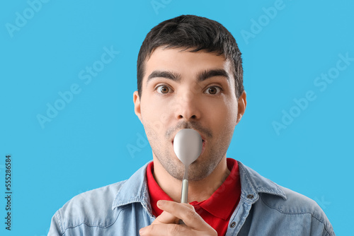 Young man with silver spoon...