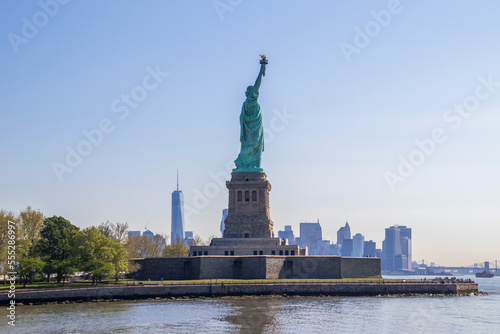 The Statue of Liberty (La Liberté éclairant le monde) and Manhattan skyscrapers at morning, Liberty Island, New York City, United States. © Itza