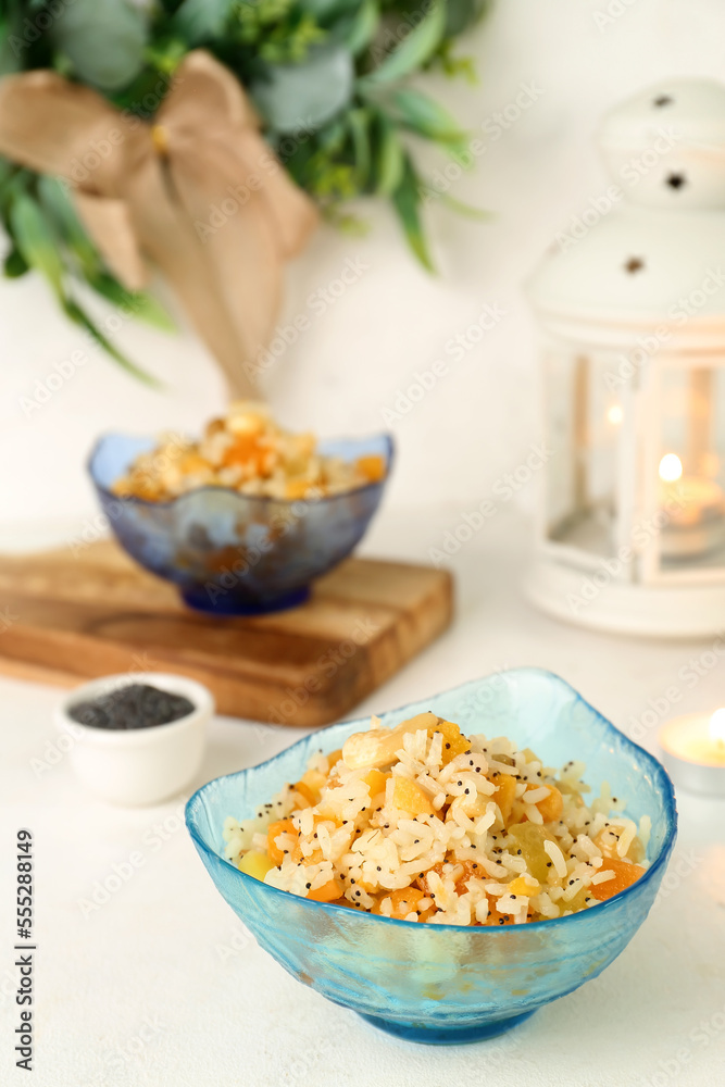 Bowl of rice Kutya on white table, closeup