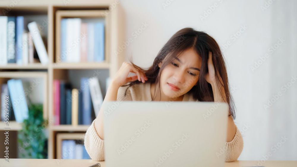 Office syndrome. Overworked tired young asian woman feeling headache, having eyesight problem after computer laptop work. Stressed young woman suffering from fatigue at home Office syndrome. Overworked tired young asian woman feeling headache, having eyesight problem after computer laptop work. Stressed young woman suffering from fatigue at home