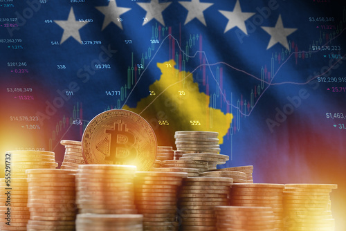 Kosovo flag and big amount of golden bitcoin coins and trading platform chart. Crypto currency concept photo