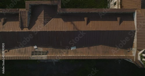 Flying Above Old Damaged Roof And Tower Of Sanatorium Iveria In Tskaltubo, Georgia. aerial topdown, sideways photo
