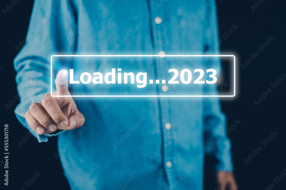 Hand using smartphone search on bar for loading 2023, start new year 2023 concept Hand using smartphone search on bar for loading 2023, start new year 2023 concept