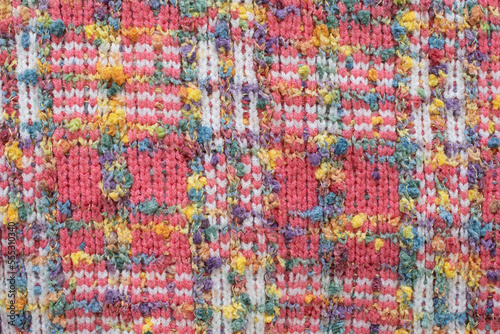 knitted sweater background texture. Real knitted fabric textured background. Colorful sweater texture. Background with knitted bright colorful sweater pattern. 