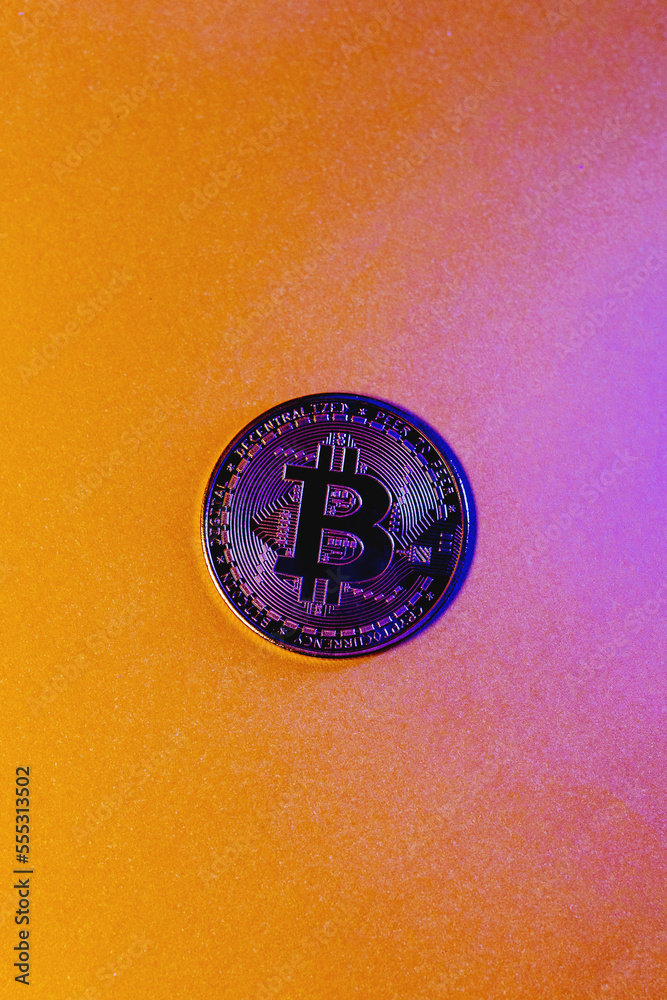 golden bitcoin coin with yellow background golden bitcoin coin with yellow background