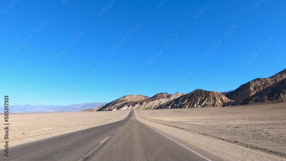 Driving Death Valley National Park at High Speed near Colorful Mountains Driving Death Valley National Park at High Speed near Colorful Mountains