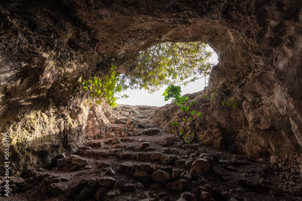 Exit  from the cave where the primitive people lived in Tel Yodfat National park, in northern Israel