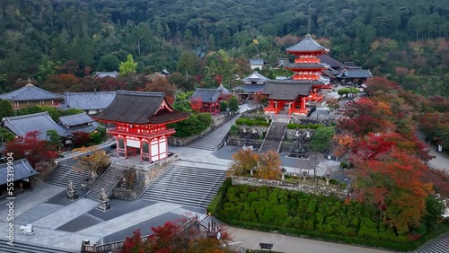 Kyoto buddhist temple aerial view, famous Kiyomizudera temple in Kyoto, Japan, in autumn, red historic pagodas of a religious Asian building