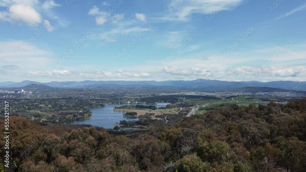 Aerial flyby of Telstra Tower in Canberra, the capital of Australia, showing a panoramic view of Lake Burley Griffin and surrounding landmarks and countryside Aerial flyby of Telstra Tower in Canberra, the capital of Australia, showing a panoramic view of Lake Burley Griffin and surrounding landmarks and countryside