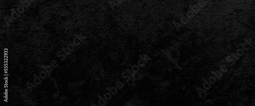 Black stone background. Free space for your text. Top view, Free space for your text, dark stone background, stone texture, black or dark gray rough grainy stone texture background.
