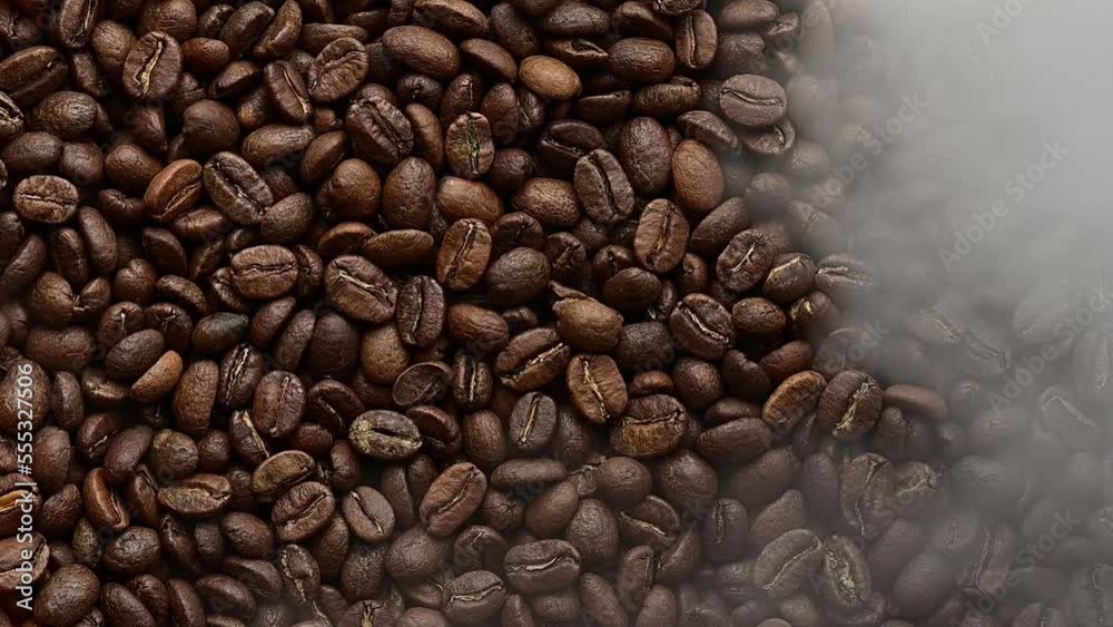 The texture of roasted coffee beans is highlighted by a warm yellow light. The texture of roasted coffee beans is highlighted by a warm yellow light.