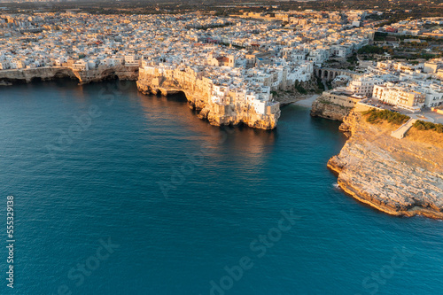Aerial view of Polignano a mare at sunset in the province of Bari in Puglia. A country on the sea a wonderful landscape