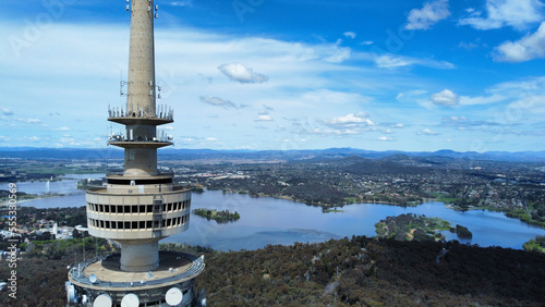 Aerial close-up view of Telstra Tower in Canberra, the capital of Australia showing a beautiful panoramic view of the city and Lake Burley Griffin photo