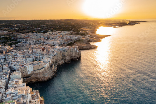Vista aerea di Polignano a mare al tramonto in provincia di Bari in Puglia. Un paese sul mare un paesaggio meraviglioso photo