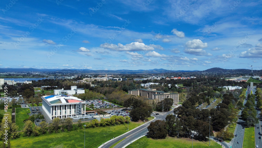 Aerial drone view of the Parliament and Commonwealth Bridge on Lake Burley Griffin in Canberra, Australia