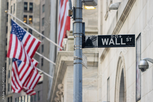 The Wall Street sign in the Financial District of Lower Manhattan in New York City. © Tada Images