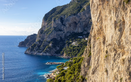 Rocky Coast by Sea at Touristic Town on Capri Island in Bay of Naples, Italy. Sunny Day.
