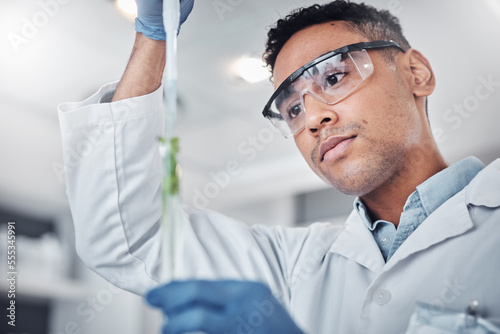 Plant science, pipette and man with test tube for researching plants. Laboratory, sustainability and male botanist with dropper and vial for testing, analyzing and gmo experiment to optimize growth. photo