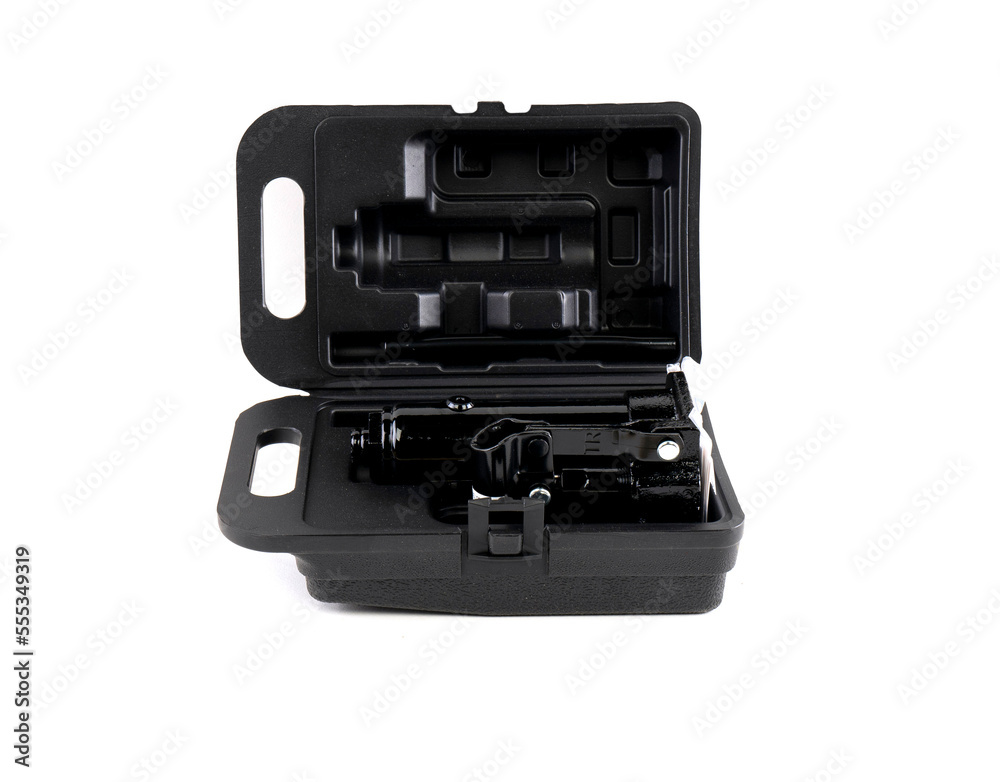 Black metal Hydraulic car floor jack in plastic case isolated on white background Black metal Hydraulic car floor jack in plastic case isolated on white background