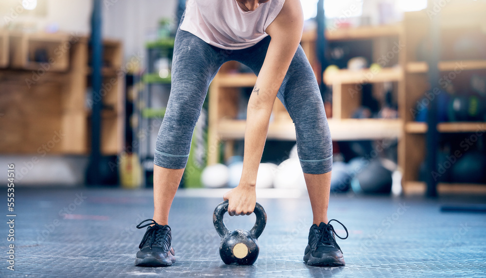 Naklejka premium Fitness, gym and kettlebell training by woman hands weightlifting for health, wellness and power goals, Exercise, weights and hand of girl in sports center for challenge and strength workout