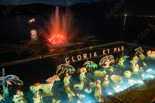 Christmas crib submerged and illuminated by colored lights in the water of Lake Maggiore in Laveno
