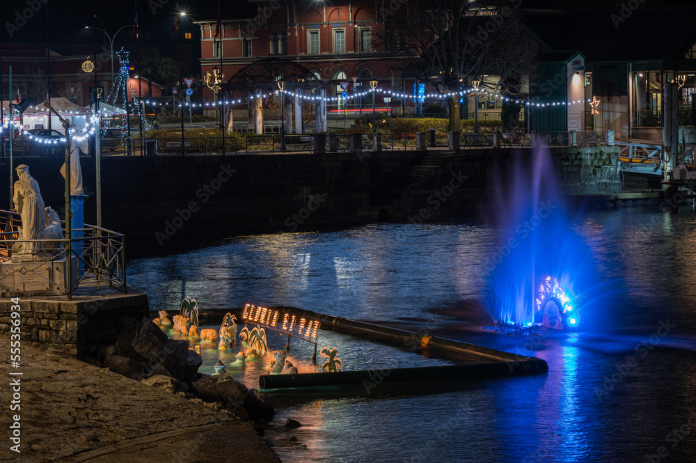Christmas crib submerged and illuminated by colored lights in the water of Lake Maggiore in Laveno