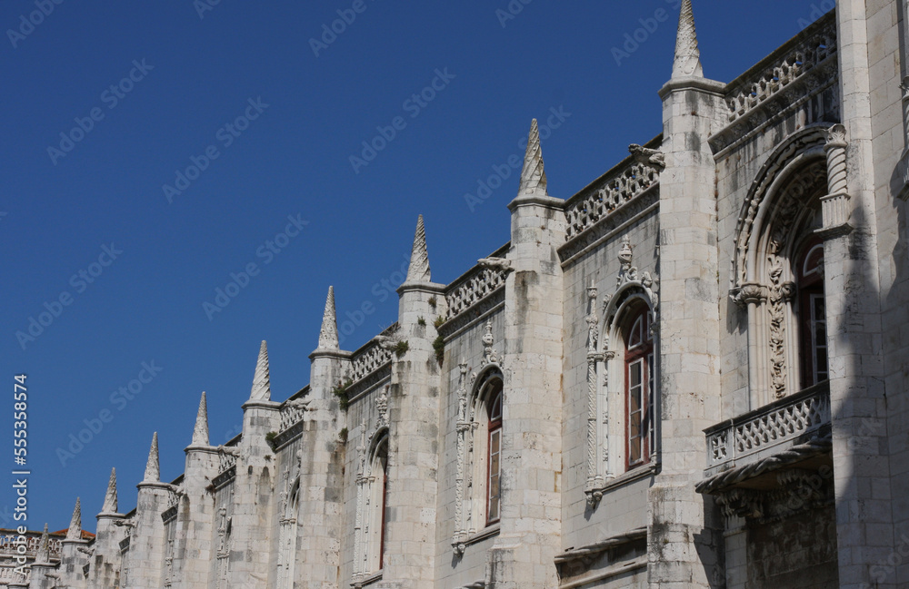 A fragment of the wall of the historic church on a cloudless summer day, Lisbon, Portugal.