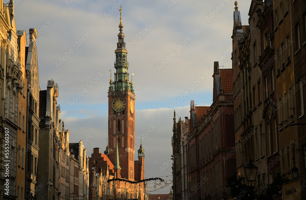 City hall clock tower in Gdańsk, Poland at sun dusk