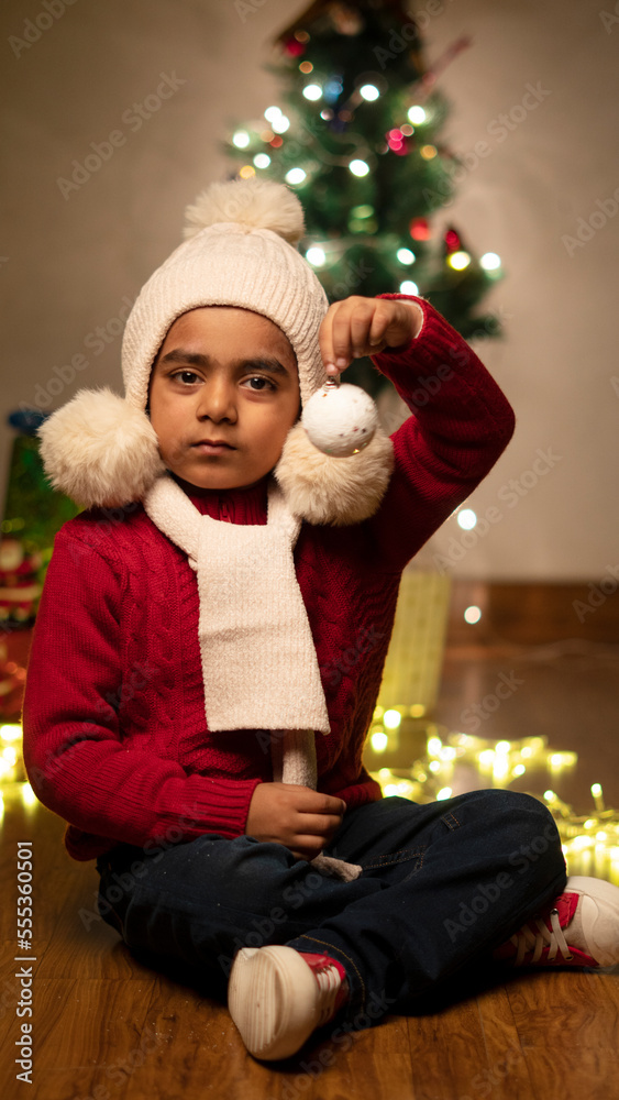 happy Indian child boy with christmas tree happy Indian child boy with christmas tree