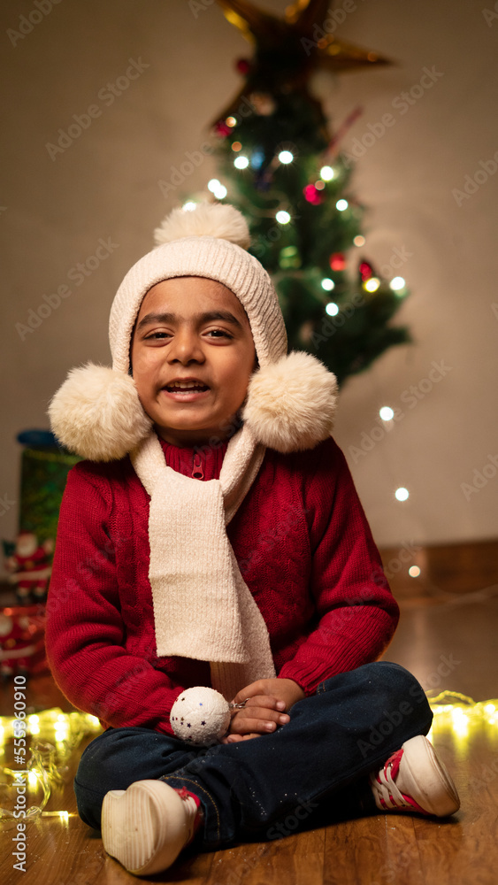 happy Indian child boy with christmas tree happy Indian child boy with christmas tree