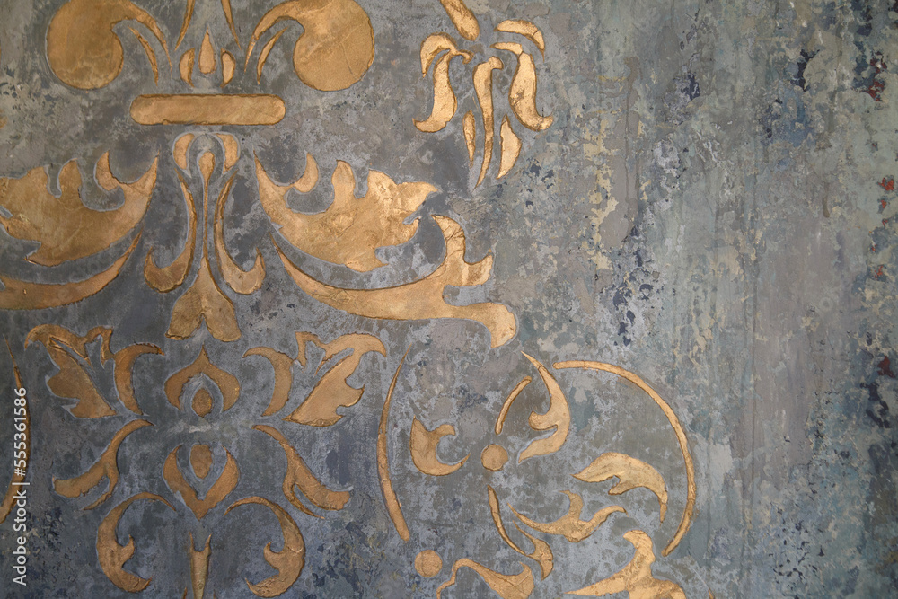 Surface with strokes of  gold paint.