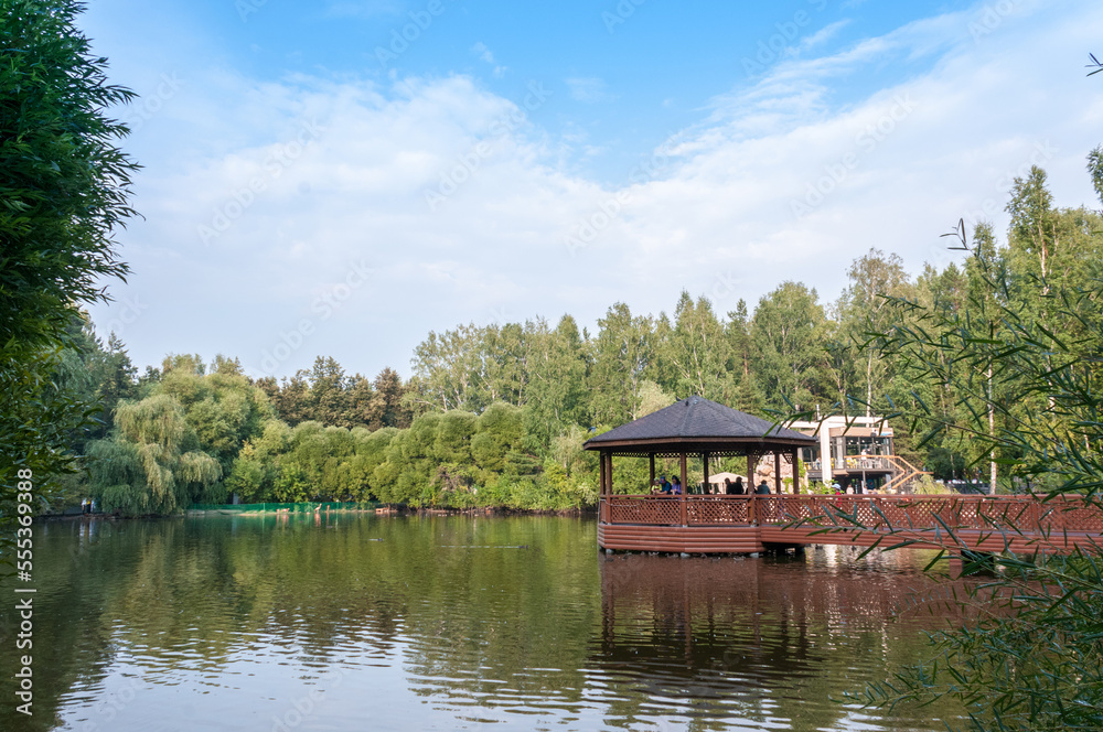Summer landscape: gazebo on Swan Lake in the Novosibirsk Zoo Summer landscape: gazebo on Swan Lake in the Novosibirsk Zoo
