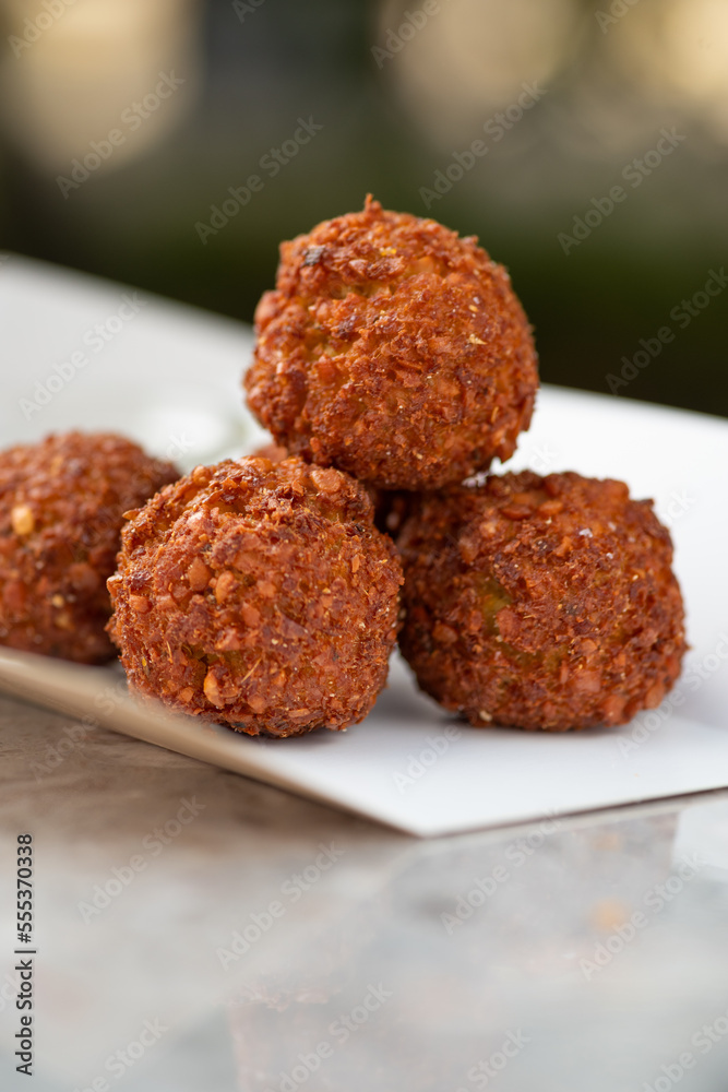 food delivery, falafel takeaway food, paper containers with falafel balls and sauce. food delivery, falafel takeaway food, paper containers with falafel balls and sauce.