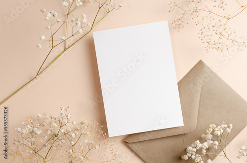 Greeting or invitation card mockup with envelope and dry flowers decor