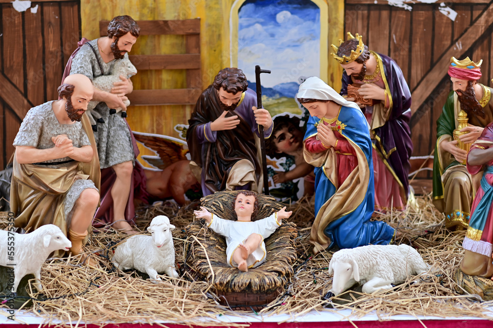 Statuettes of Mary, Joseph and baby Jesus,The birthday of Jesus is a statuette of Maria with Joseph and newborn Jesus on the hay, A Christmas nativity scene. Statuettes of Mary, Joseph and baby Jesus,The birthday of Jesus is a statuette of Maria with Joseph and newborn Jesus on the hay, A Christmas nativity scene.