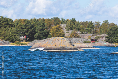 Archipelago National Park landscape, Southwest Finland, with islands, islets and skerries, Saaristomeren kansallispuisto, summer sunny day, view from shuttle ship ferry boat in the Archipelago Sea photo
