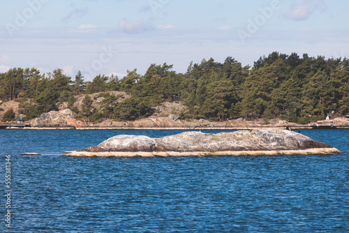 Archipelago National Park landscape, Southwest Finland, with islands, islets and skerries, Saaristomeren kansallispuisto, summer sunny day, view from shuttle ship ferry boat in the Archipelago Sea photo