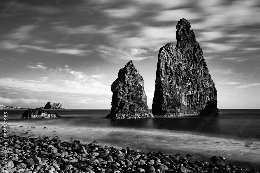 lava rocks in the Atlantic Ocean, island towers in Ribeira da Janela, Madeira Island, Portugal. Rock formations are of volcanic origin