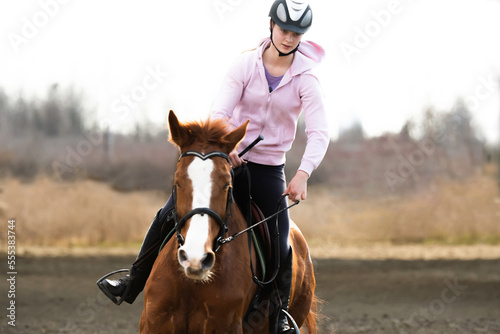  woman riding a horse