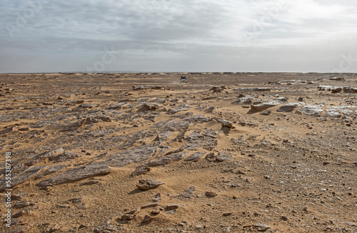 Barren desert landscape in hot climate with off-road vehicle