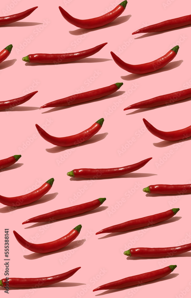 red chili peppers on pink background. Minimal food background